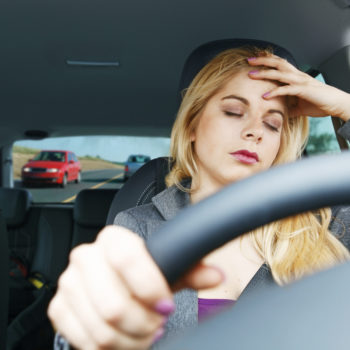 Tired girl driving a car. See my similar photos: